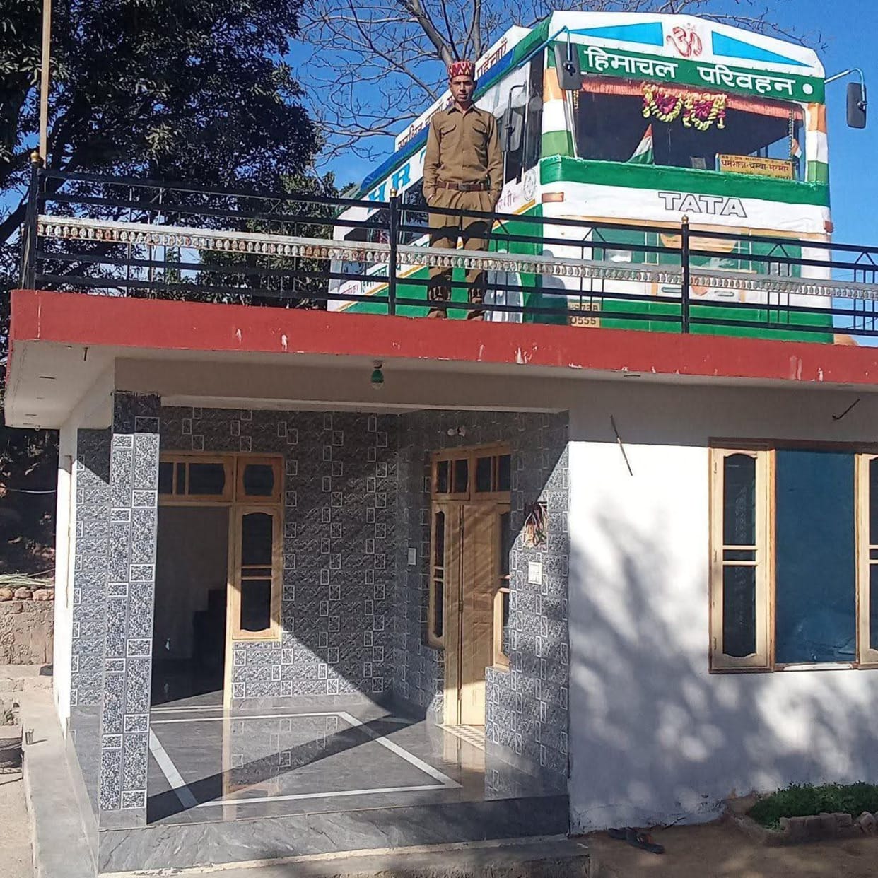 Work became passion... built a government bus on the roof of the house
