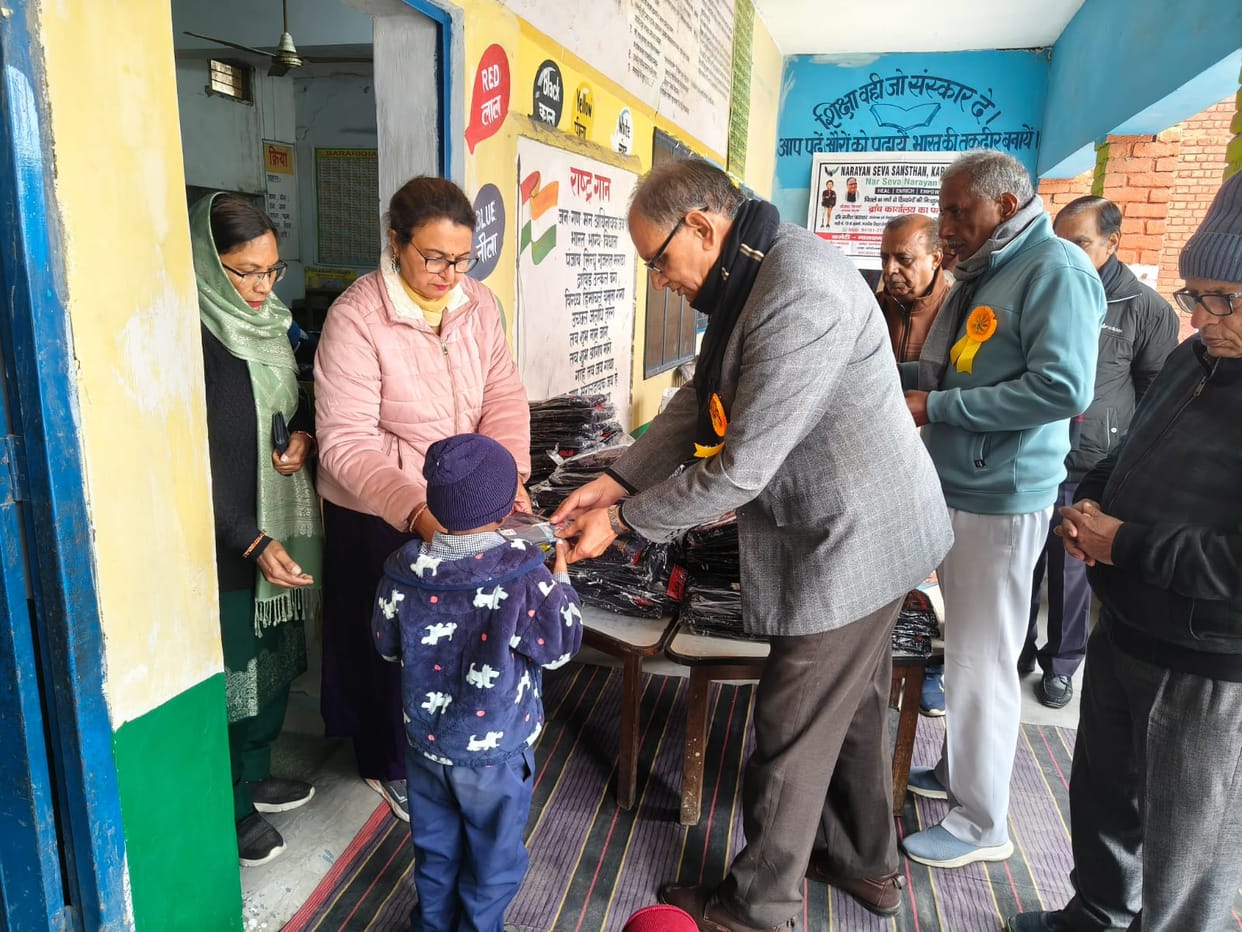Distribution of warm clothes and socks to children