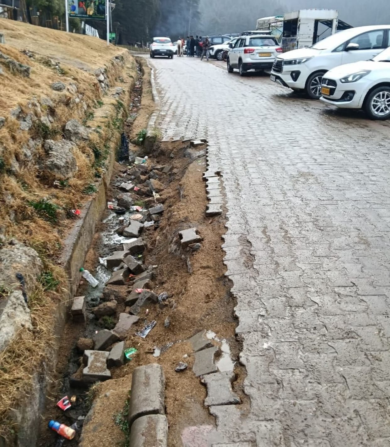 Uprooted tiles in Khajjiar causing damage to vehicles