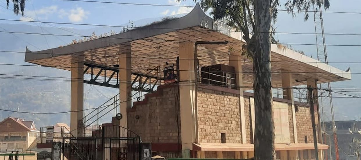 Grass growing on the roof and broken drainage system are giving testimony of neglect.