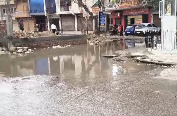 The road near Peer Baba's shrine is flooded with water.