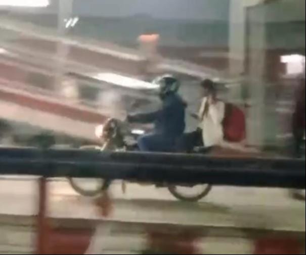 Passengers were surprised to see a motorcycle speeding on the railway station platform.