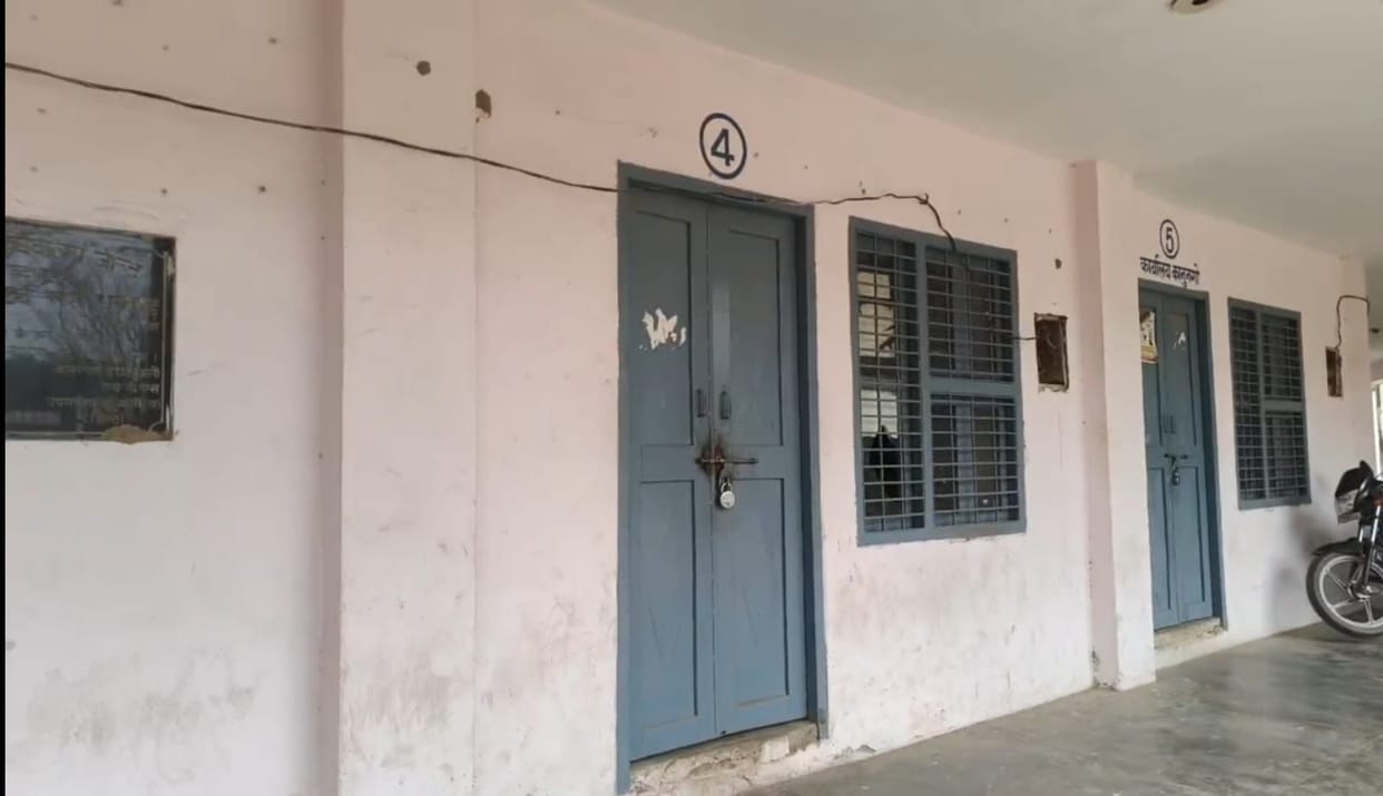 The patwari (village accountant) is absent from the patwari office, the rooms are locked, and people are returning disappointed.