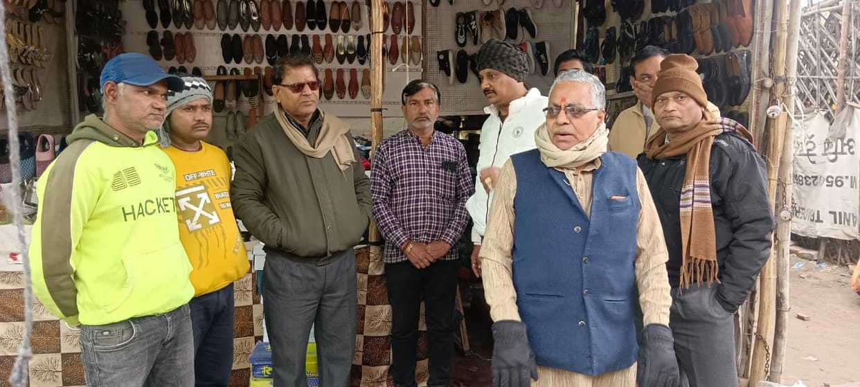 Business leaders met with the shopkeeper who was a victim of the fire.