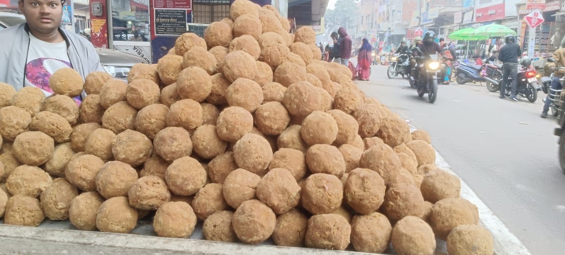The market is filled with the sweet aroma of sesame and jaggery during the winter season.