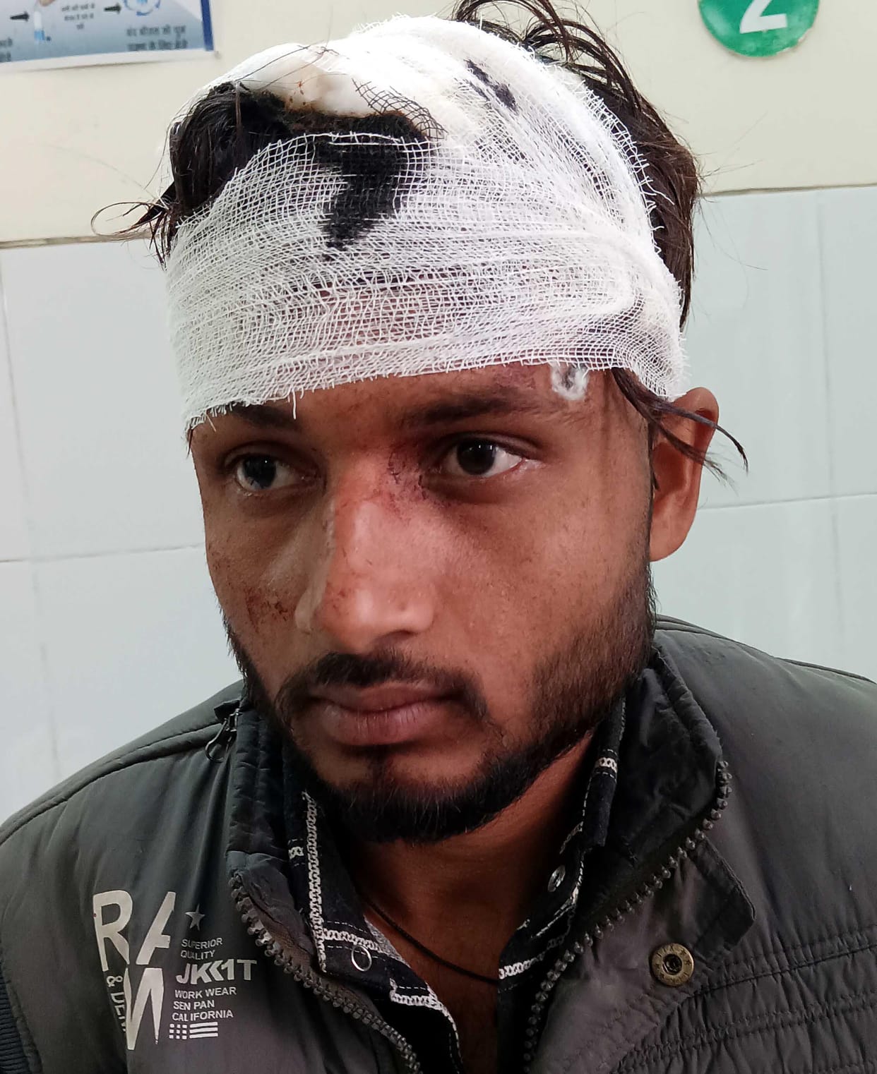 A young man was attacked for protesting against verbal abuse; his head was injured, and a case has been filed against three people.