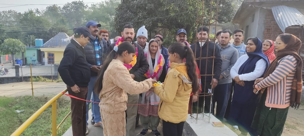 A concrete road was opened for the settlement, and the head inaugurated it.