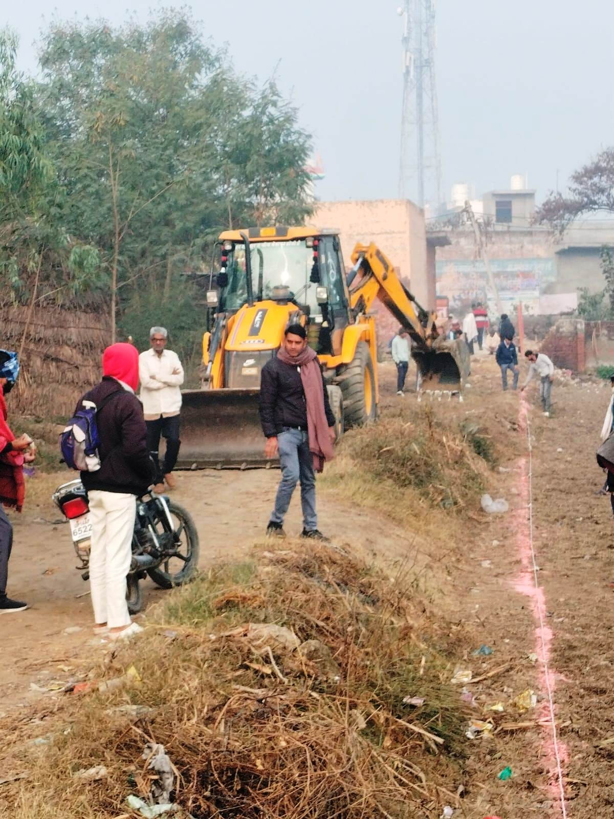 Stone pelting during removal of illegal encroachment and construction of road.