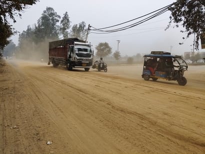 The dust from overloaded dump trucks has increased the risk of accidents