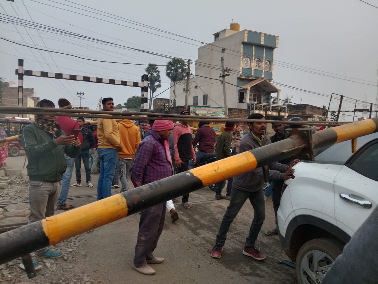 Jamalpur-Munger rail section Uncontrolled car breaks through railway gate gets stuck train operations halted
