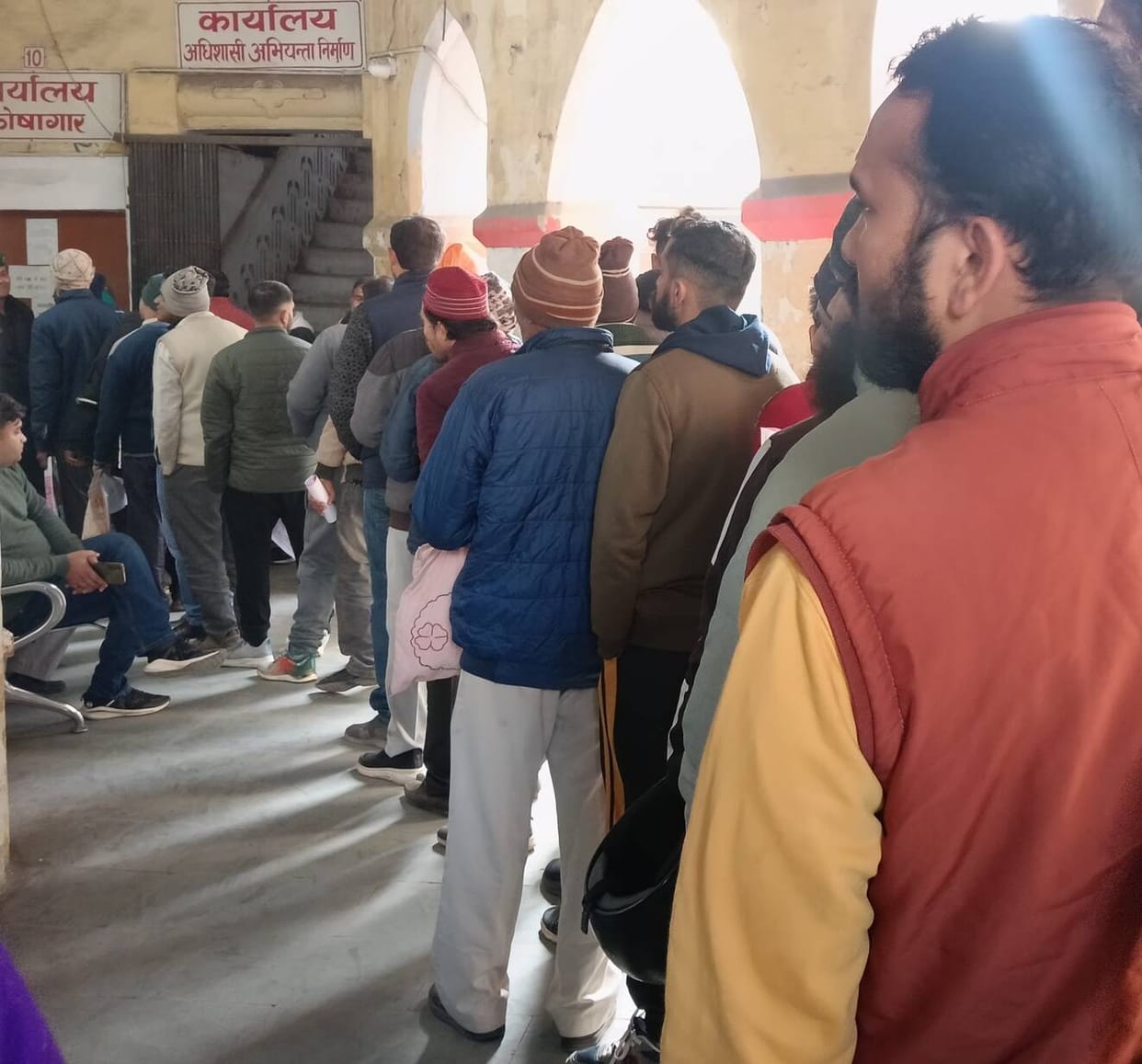 Queue for certificate, tin shed getting ready for waiting room