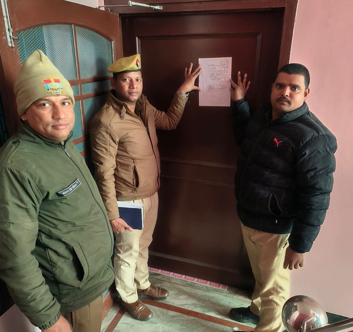 Attachment notice pasted on the house of a doctor accused of sexual harassment