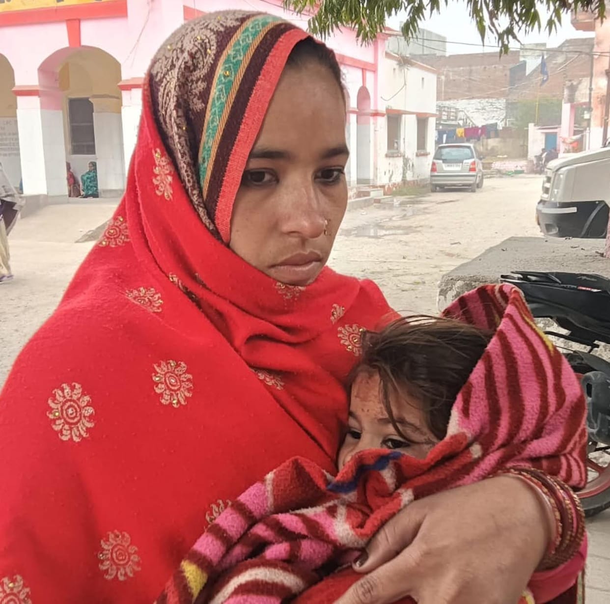 In a land dispute, neighbors picked up and threw a young girl, causing her head to be injured.