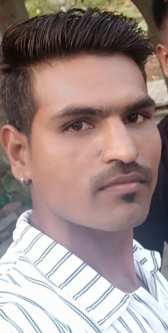The body of a young man was found hanging from a noose in his wife's room.