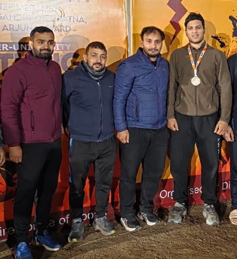 Prince wins gold at the All India Inter-University Wrestling Championship.