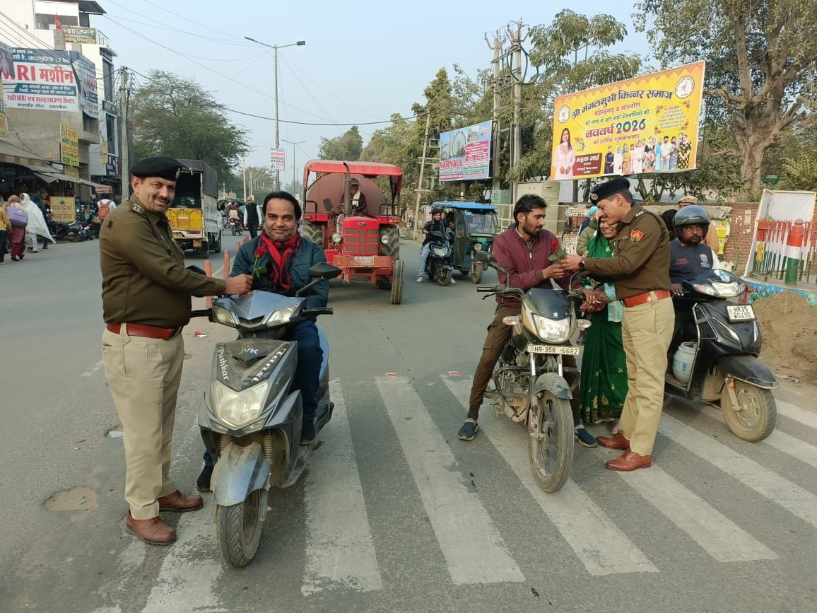 Drivers without helmets were given roses to raise awareness.