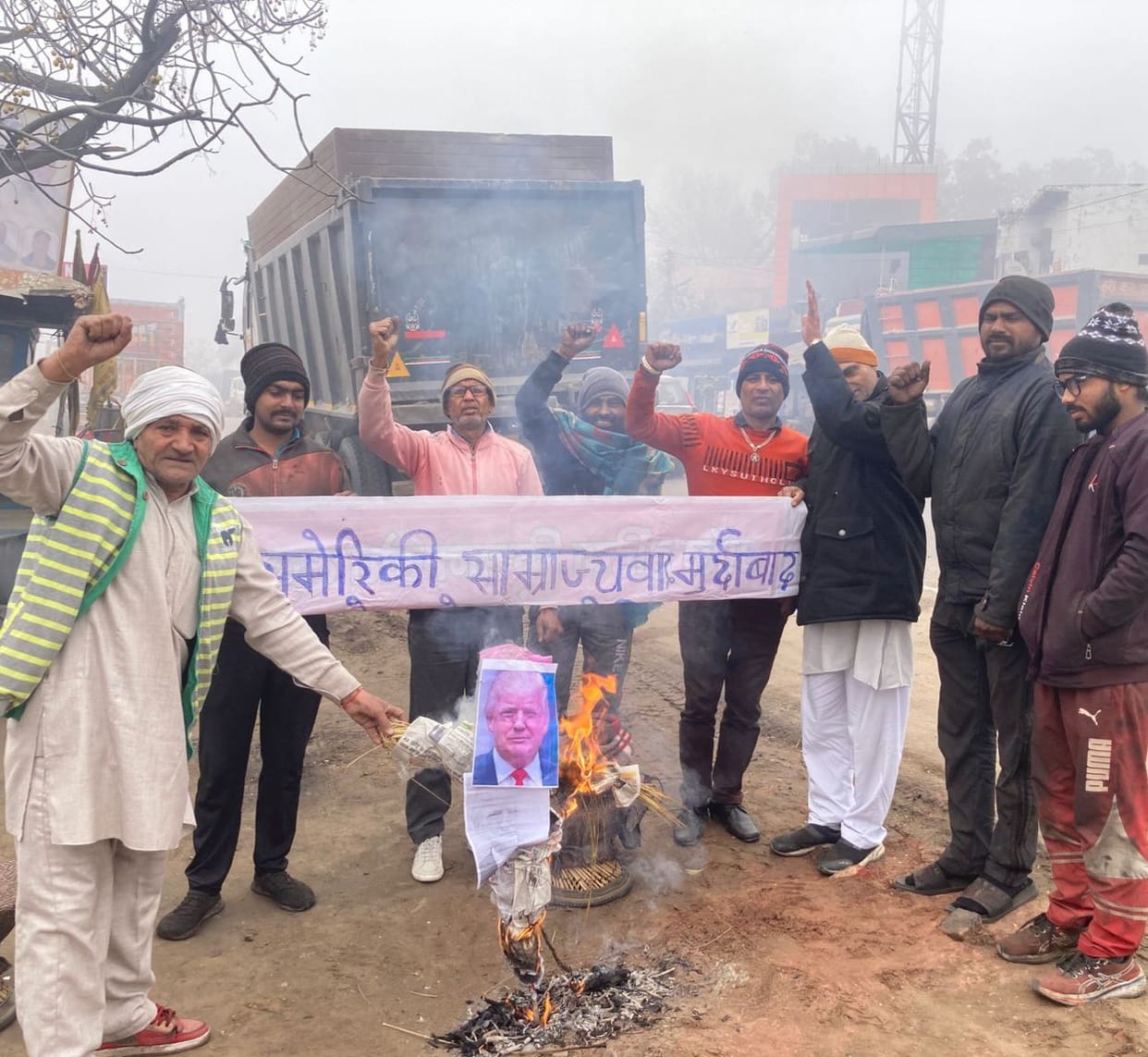 SUCI burned an effigy of US President Trump.