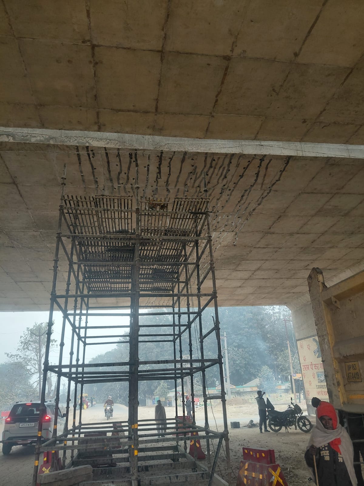 Cracks appear in the roof of the PPganj-Bandhupur underpass, and chemicals are being filled in.