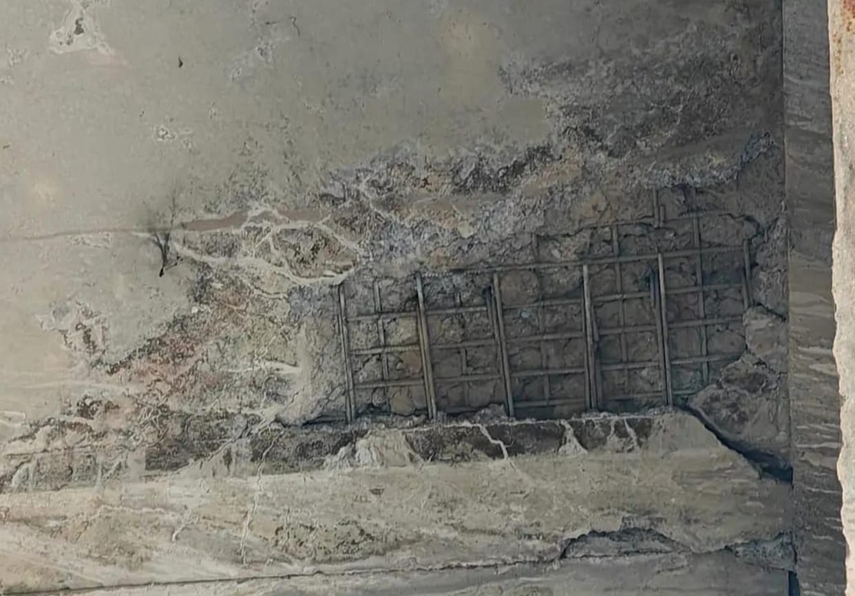 Debris falling from the roof of Aung Overbridge, increasing the risk of accident