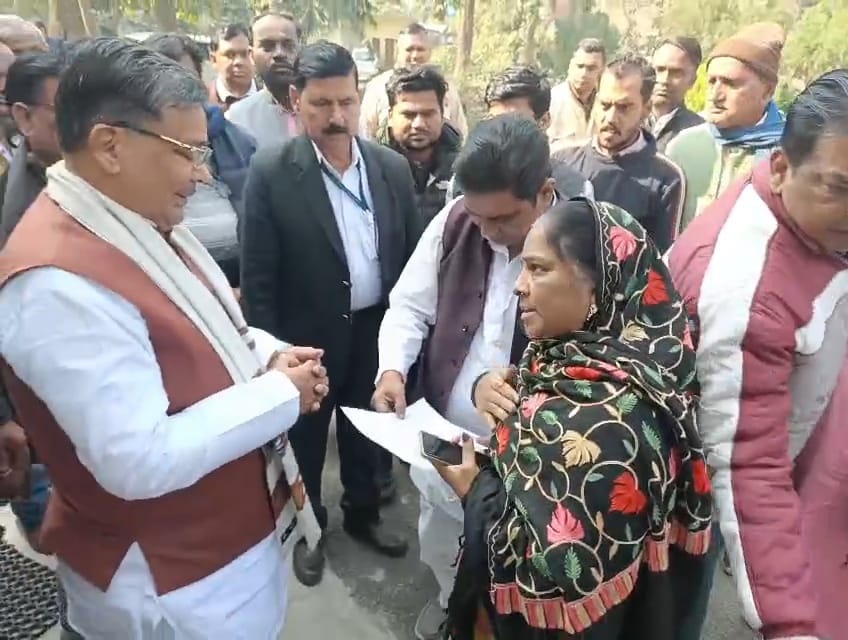 The woman accused the BJP leader of land grabbing in front of the minister in charge.