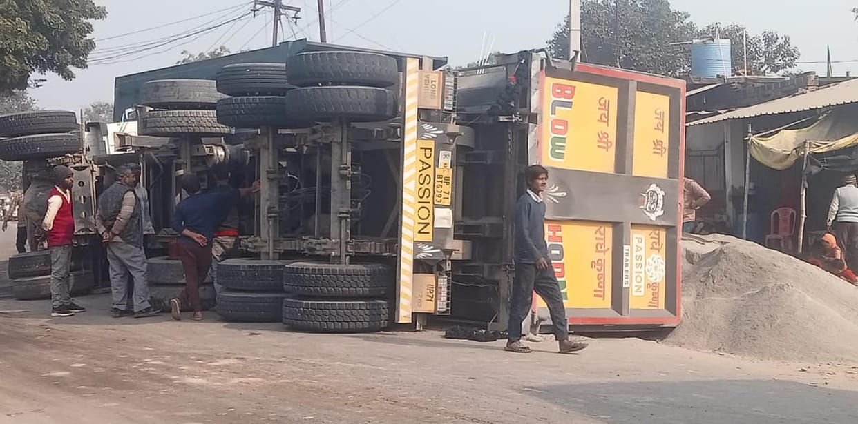 Trucks collide, driver and helper survive