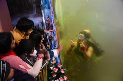 A mermaid arrives for the first time at the Gorakhnath fair, attracting children in Gorakhpur