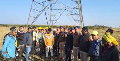Drunk man climbs high tension tower