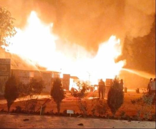 Closed houses and huts engulfed in flames