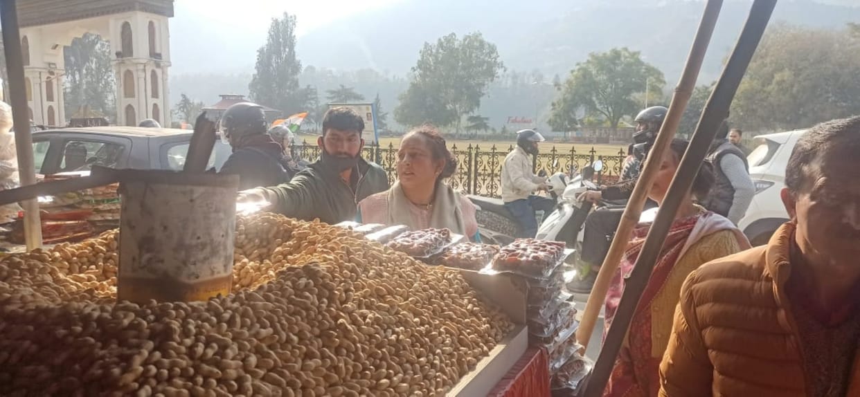 The market smells of peanuts, gajak and rewadi