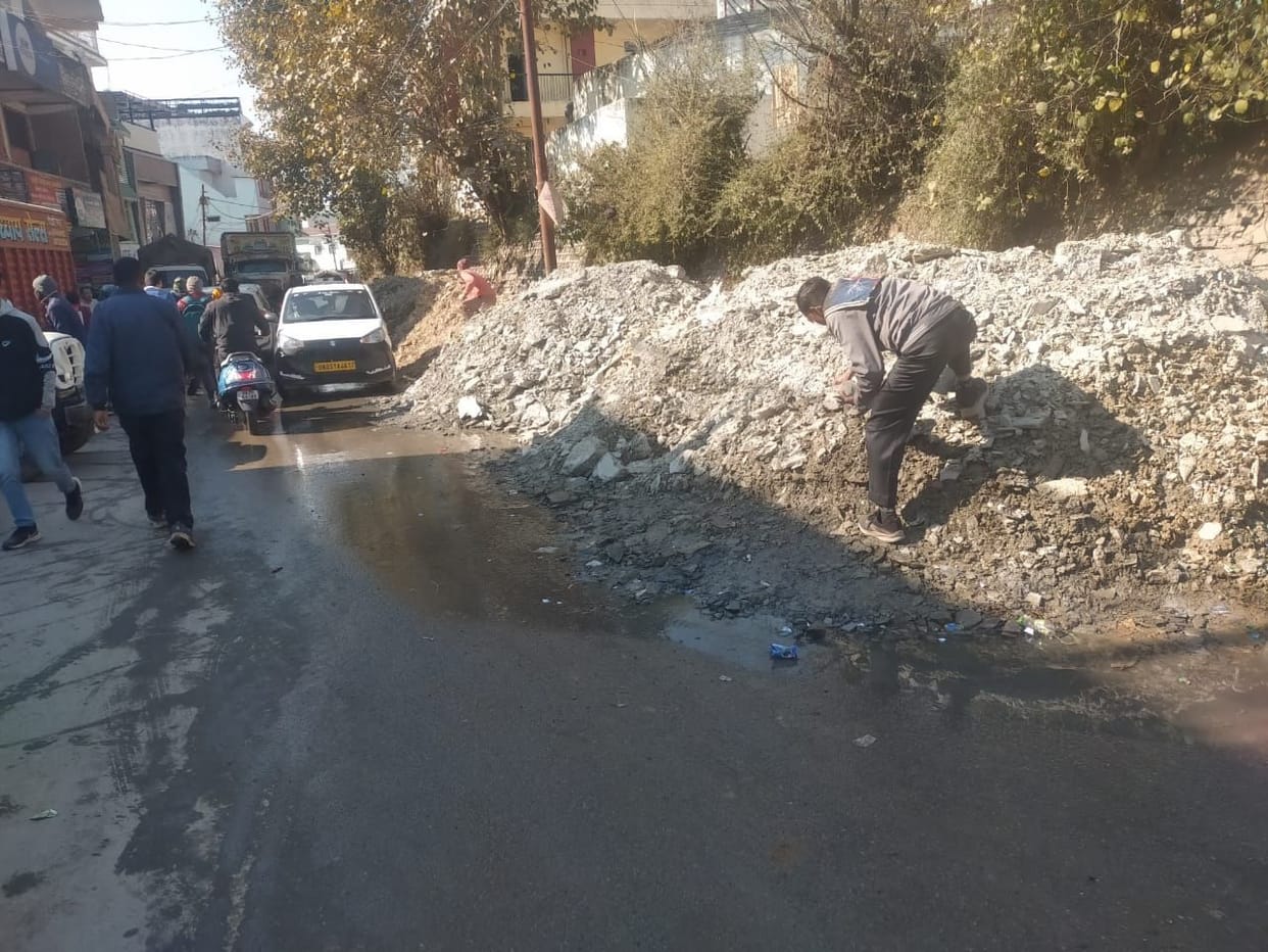 The road has been turned into a dumping zone, making it difficult to walk on it.