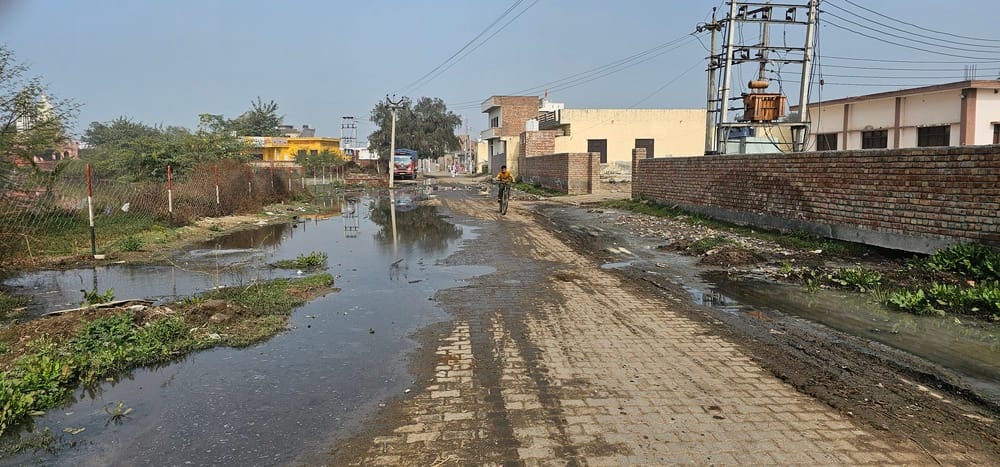 Pond water spread in the main street of Batta