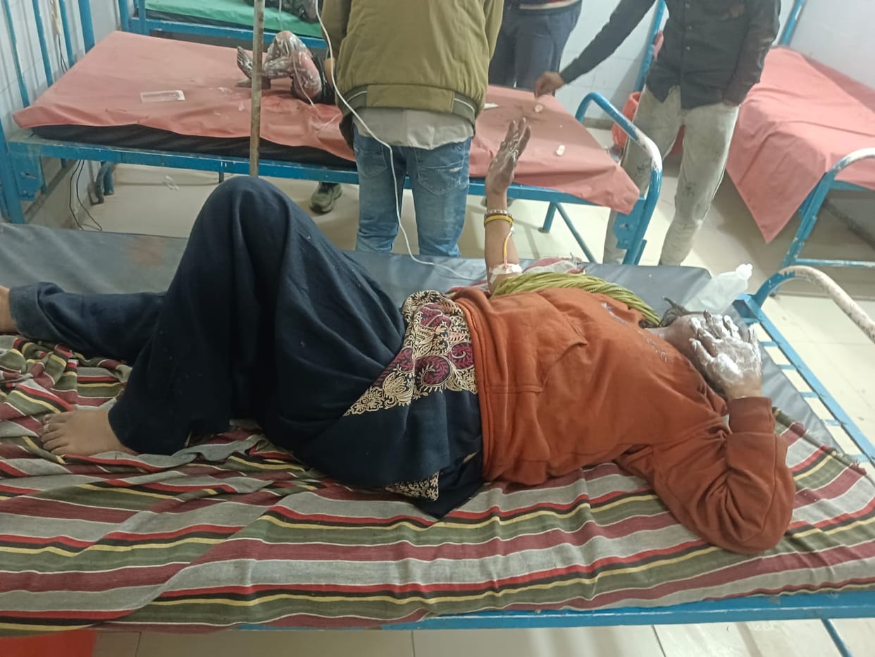 A fire started by a candle injured a woman and three children.
