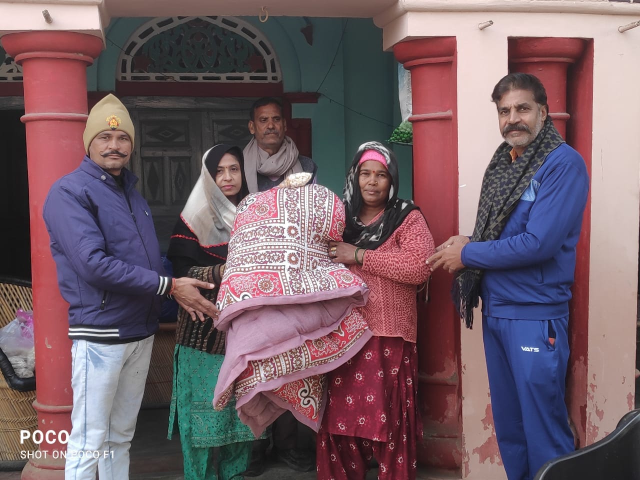 Distributed blankets and quilts to the needy