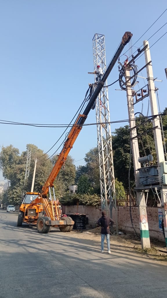 Rubber wires are being installed on the HT poles on Bhattu Road.
