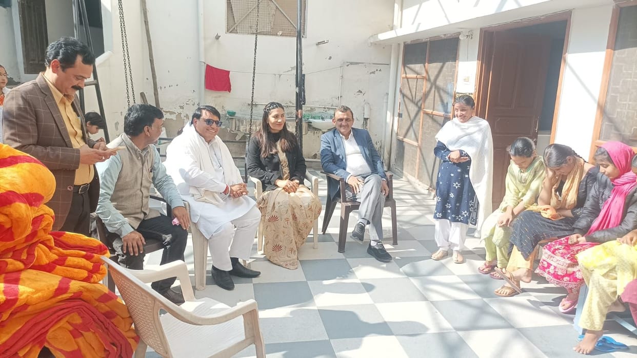 The district judge visited the school for the blind.