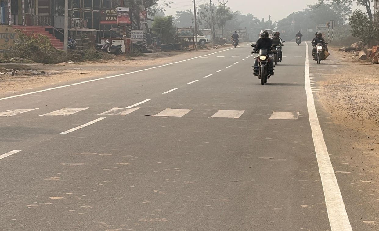 The road with a white stripe will be less dangerous.