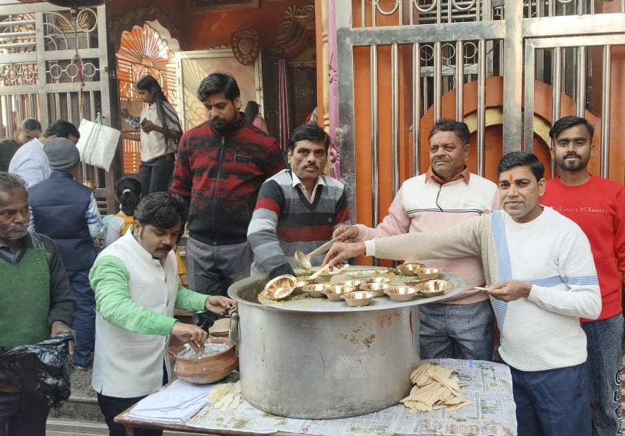 Devotees offered 'khichdi' (a dish of rice and lentils) at the temples and performed acts of charity.