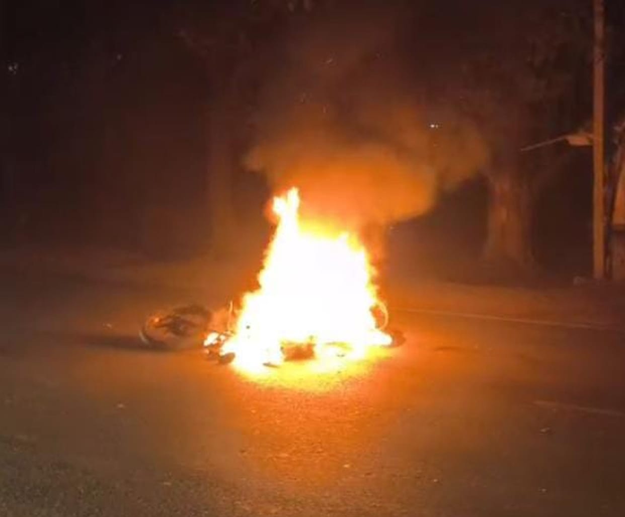 A motorcycle caught fire after colliding with a DCM truck; the young man died from his injuries.