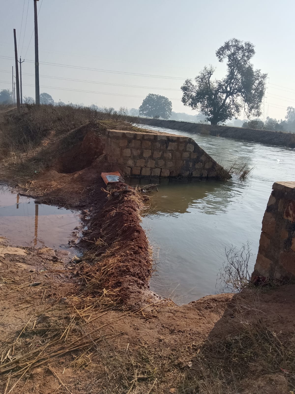The embankment broke at night, and canal water entered the settlement.