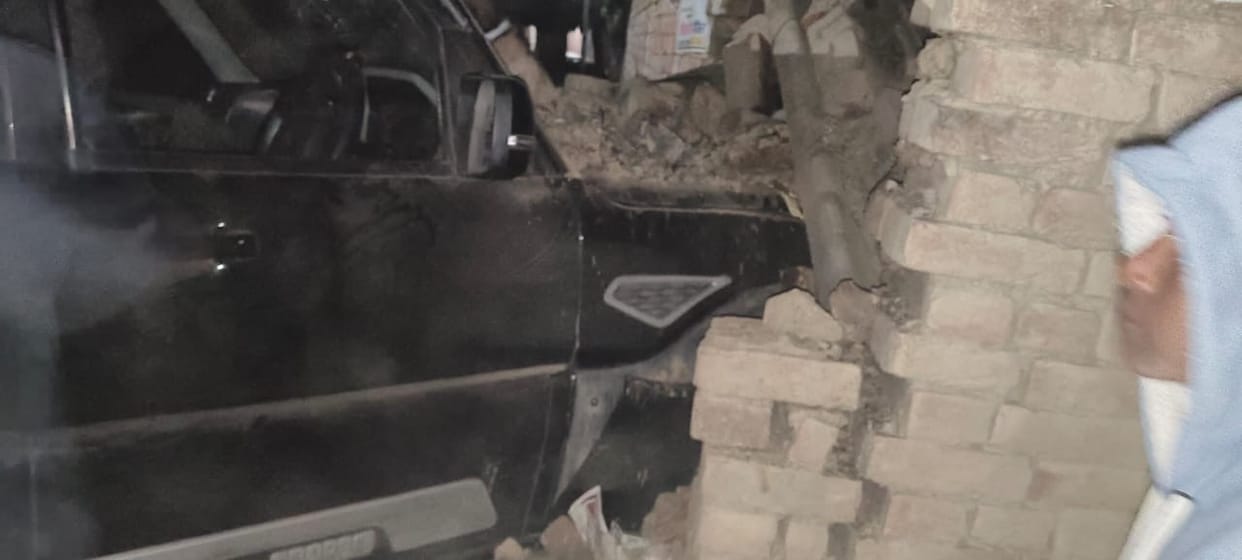 A car crashed through the wall of a house, and a young woman was trapped in the rubble.