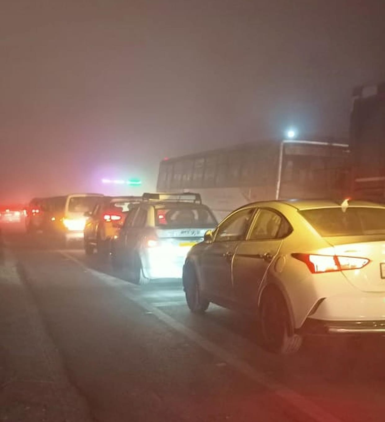 Long traffic jam caused by overturning of sugarcane laden trolley on the highway