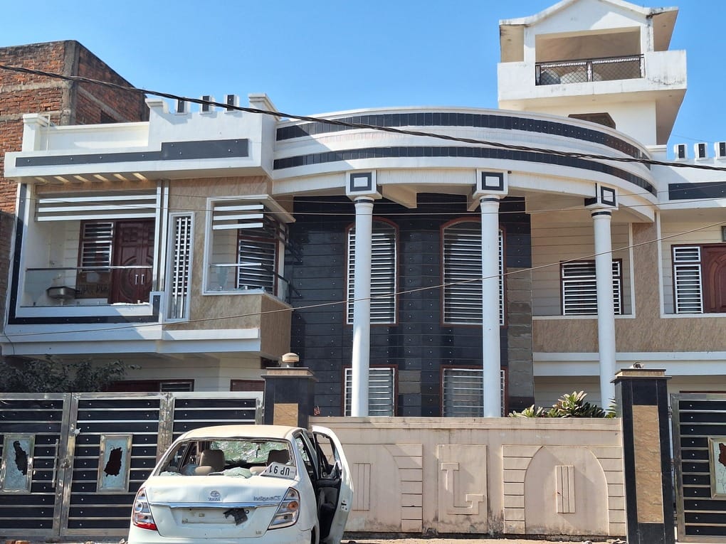 The accused's father's mansion is on government land.