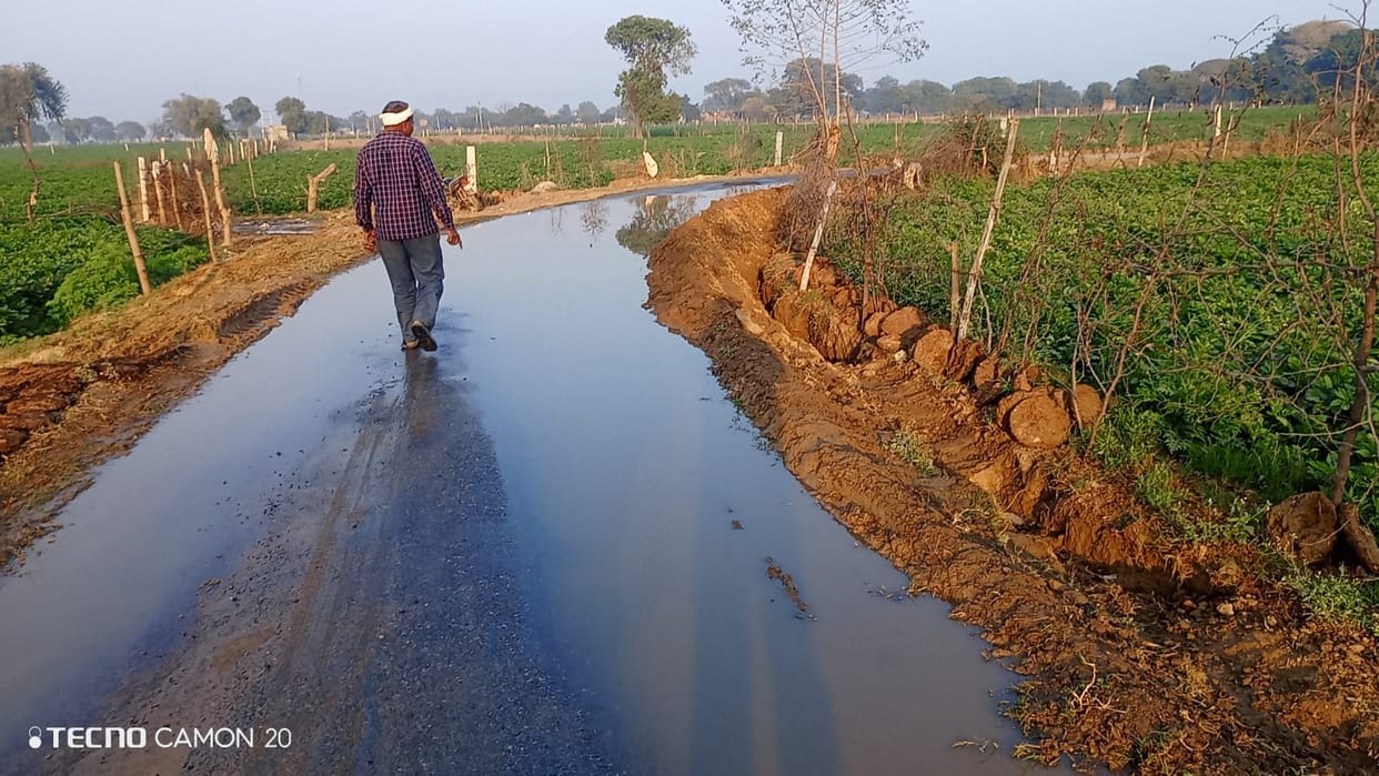 Pond water filled the road, anger among villagers