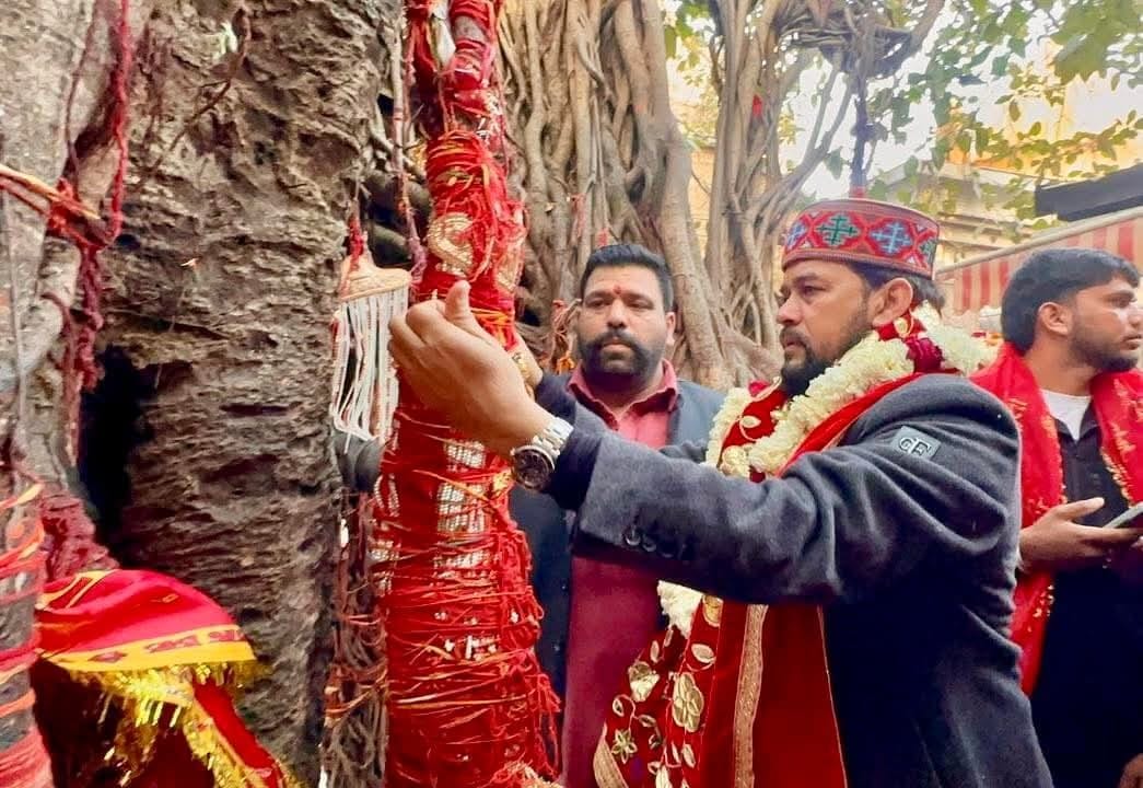 Anurag tied a sacred thread around the root of the banyan tree and made a wish.