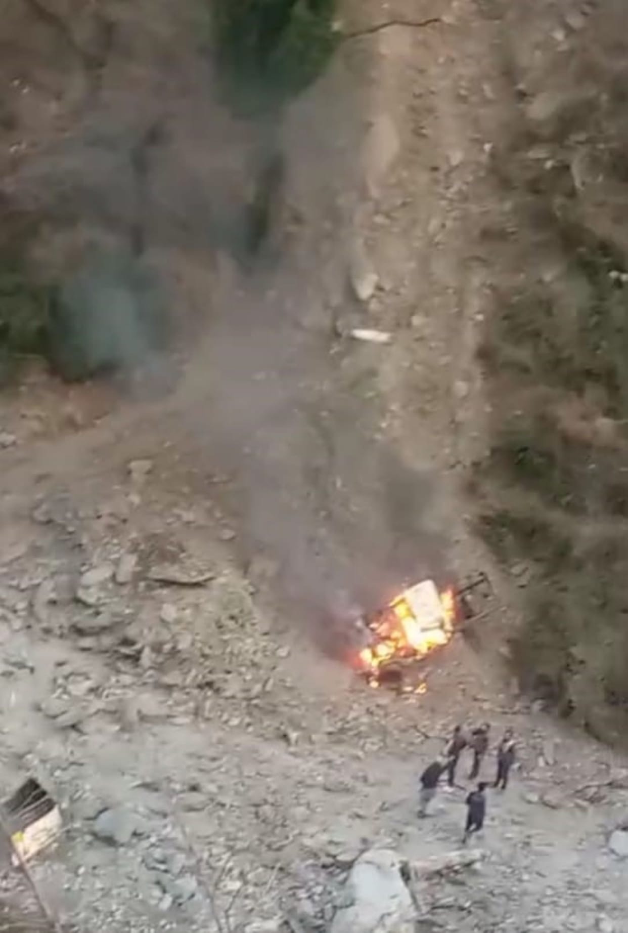 The pickup fell, split in two, and burst into flames.