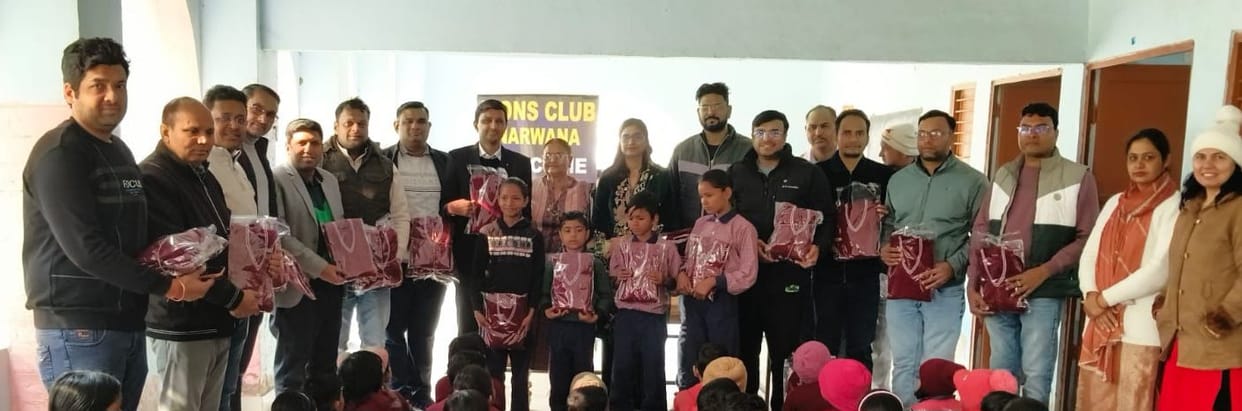 Sweaters were distributed to 115 needy children.