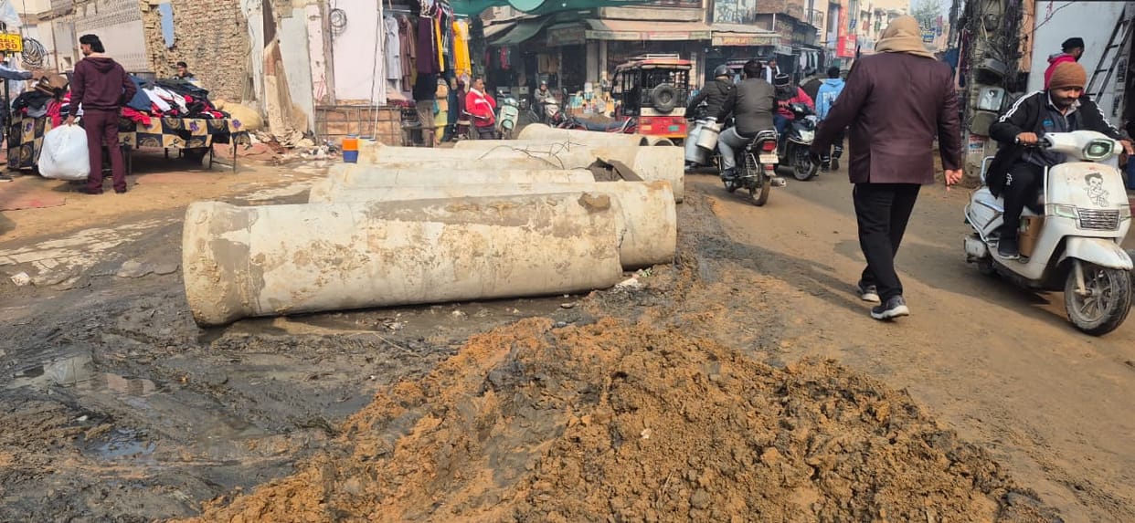 People struggled with traffic jams in Sarai Choupata as the rainwater drains, which are over four and a half decades old, got uprooted