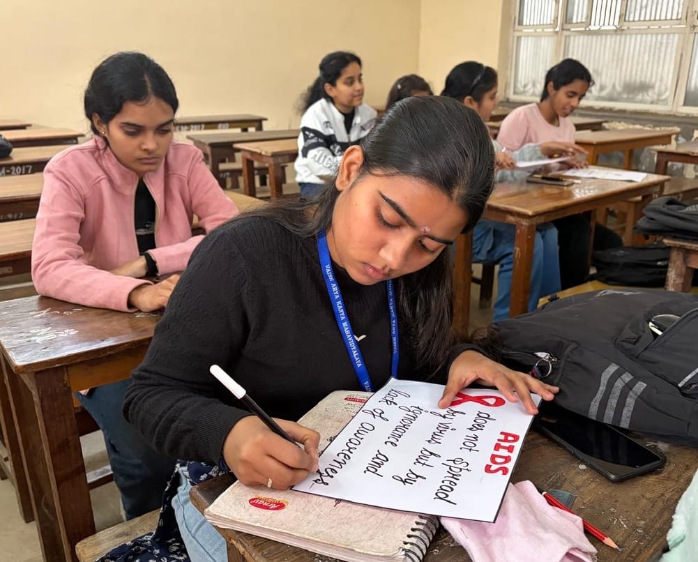 Awareness about AIDS was raised through poster and slogan writing.