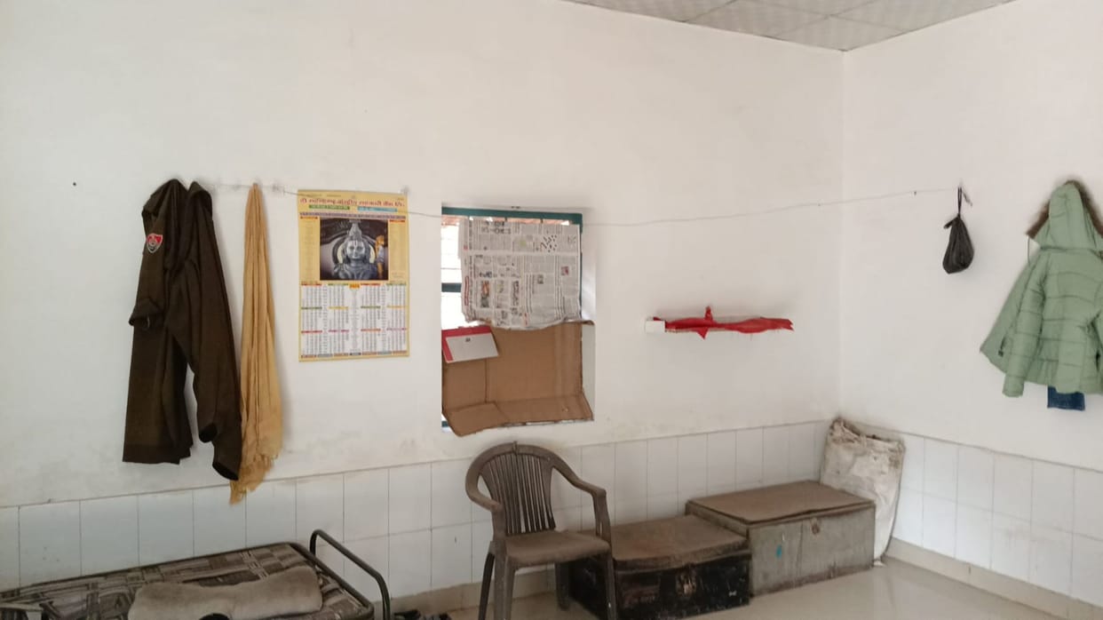 Female officers forced to change into their uniforms behind windows covered with newspapers at the GRP police outpost.