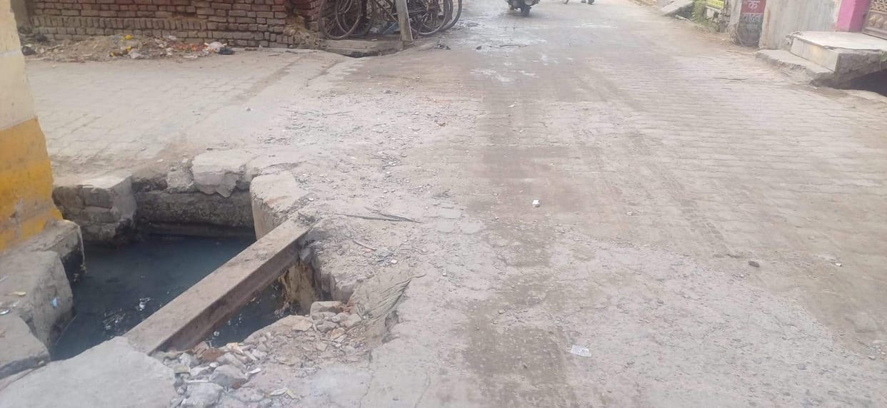 The road near the temple is damaged, raising fears of accidents involving large vehicles.